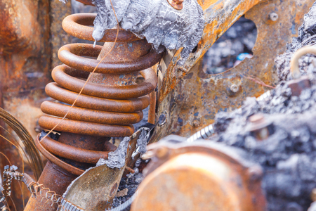 burned down car standing in the middle of the carriageway, in a city that cannot be restored.の写真素材