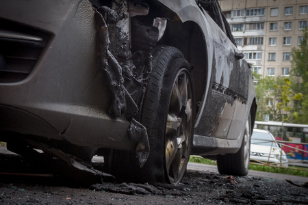 partially burned down car after the fire, parts of body the burned handles of doors and the burst glasses, picture not from pleasant, the insured cars after the fireの写真素材
