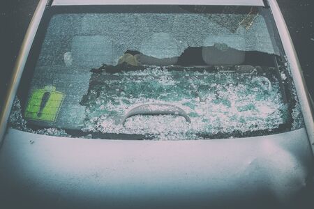 Broken rear glass of car spread fragments of glassの写真素材