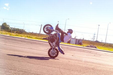 St. Petersburg, Russia - June 2019: moto rider making doing a difficult and dangerous stunt on his motorbikeのeditorial素材
