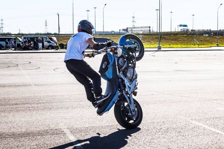 St. Petersburg, Russia - June 2019: moto rider making doing a difficult and dangerous stunt on his motorbikeのeditorial素材