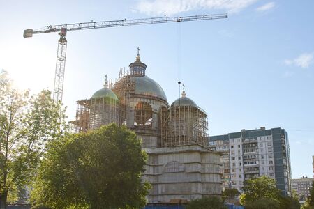 Industrial construction cranes the construction of an building.の写真素材
