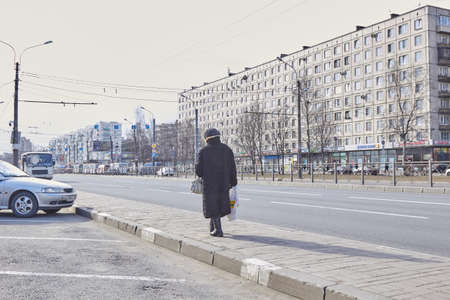 Saint Petersburg, RUSSIA - March 25, 2020: elderly people on the streets of the city.のeditorial素材