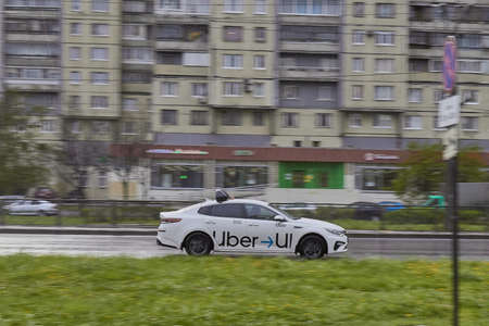 Russia, Saint-Petersburg, 10 August 2019:city taxi on a blurry background in traffic.のeditorial素材