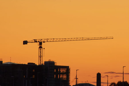 Industrial construction cranes the construction of an building.