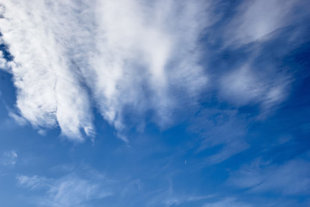 clouds against a blue sky view from below.