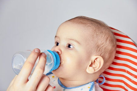 A baby drinking from a bottle