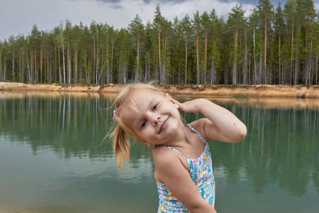 child against the background of nature, freshness, and a healthy lifestyleの写真素材