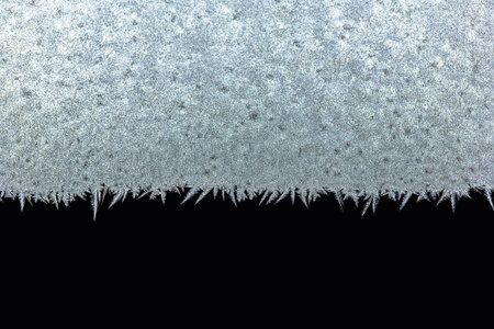 winter ice pattern on glass, selective focus
