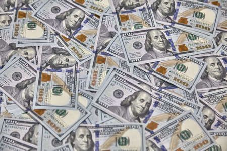 100 USD banknotes lots of background texture close up moneyの写真素材
