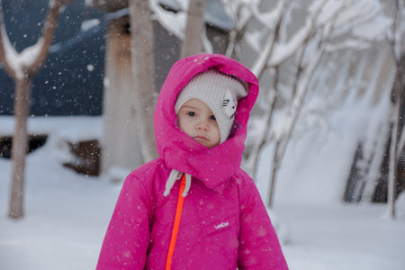 Winter snow children on the background of a snow-covered forest.