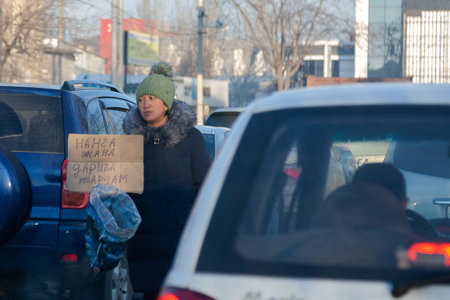 Bishkek-Kyrgyzstan. January 2021. A crippled beggar on the road asks for help .