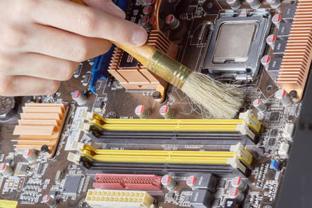 Computer repair cleaning of components, from dustの写真素材