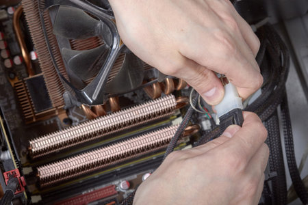 Connecting computer connectors, laying wires, cleaning dust