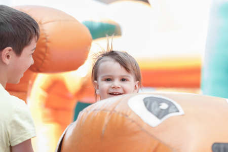 Portrait of a joyful child on an amusement rideの写真素材