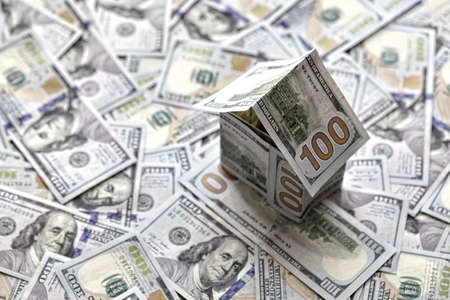 house of money on the background of money, dollar bills the concept of accumulating investing moneyの写真素材