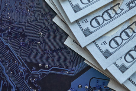 Printed circuit board chips, electronics technology, against the background of money. The concept of technological progressの写真素材