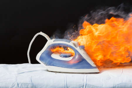 On the ironing board fire caused by faulty electrical wiringの写真素材