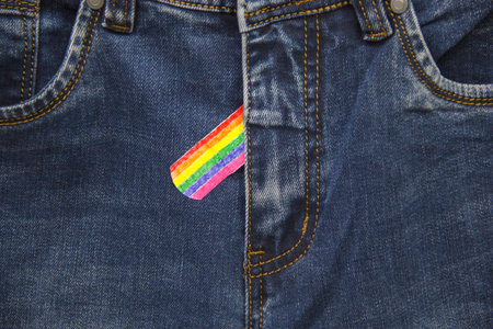 The fly of the jeans is taped with an LGBT flag, a denial of homosexualityの写真素材