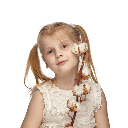 Blonde baby 6 years old, in a white dress shows a emotion chartの写真素材