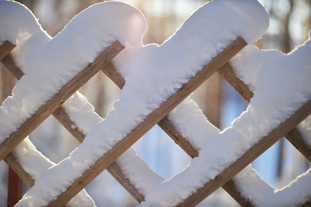 Frozen Whispers, A Captivating Macro Shot of a Snow-Adorned Fenceの写真素材