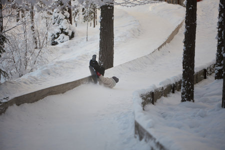 Gravitys Symphony, An Adventurous Snowboarder Soaring Down an Alpine Wonderlandの写真素材