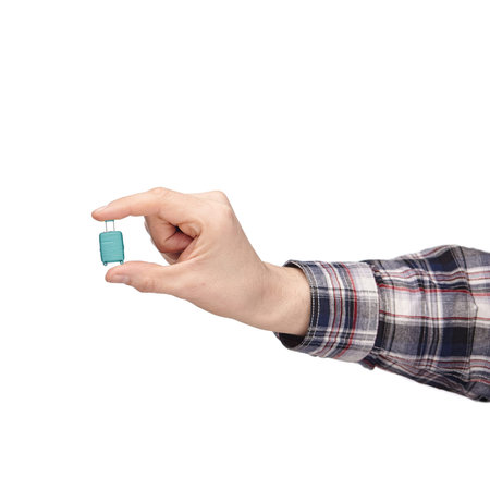 luggage and hand luggage, a miniature mint-colored suitcase on a white isolated background in the...