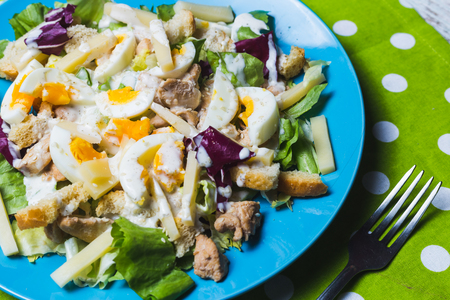 Salad Caesar with eggs, chicken and cheeseの写真素材