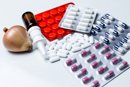 Many colorful pills on white backgroundの写真素材