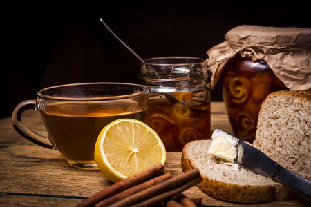 Orange jam in jar on wooden backgroundの写真素材