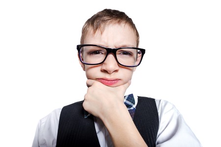 Stylish schoolboy closeup portrait isolated on white backgroundの写真素材