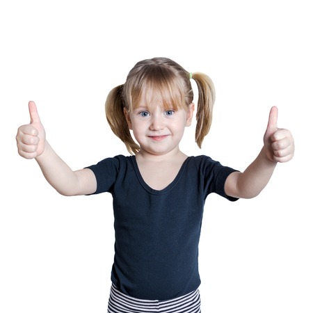 Cute girl showing thumbs up with both hands, isolated on whiteの写真素材