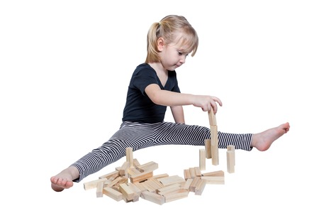 Happy child playing building blocks isolated on white baclgroundの写真素材