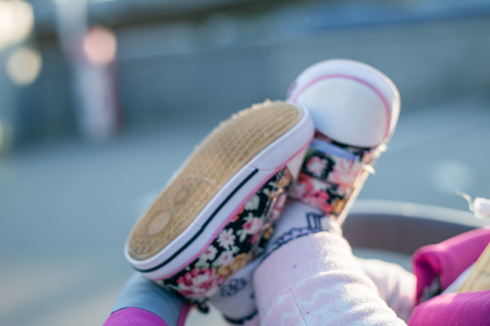 Toddler legs in the baby seat. Closeup photoの写真素材