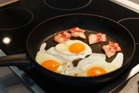 English breakfast - fried egg, bacon and toast in Norwayの写真素材