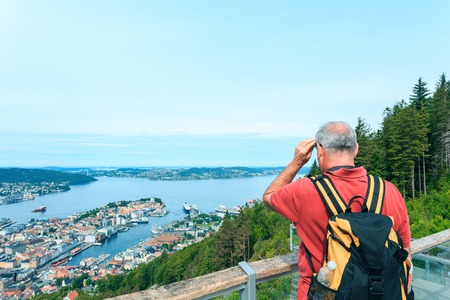 Old tourist watching on Bergen from top, Norwayの写真素材