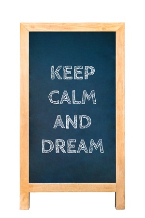 Board with the text Keep calm and dream on white backgroundの写真素材