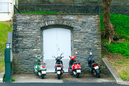 Motorbikes parked on the street of Bergen. Bergen is a popular tourist attraction of Norwayの写真素材