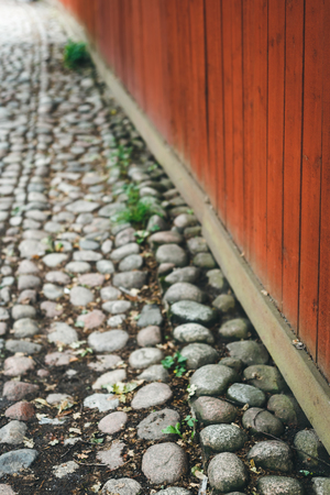 Dark grey stone pavement of the old paversの写真素材