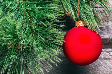 Christmas background with red Christmas ball. Vintage gray wallの写真素材