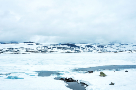 Norway mountain landscape with snow at summerの写真素材