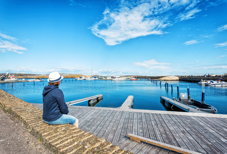 Girl in hat in seashore view in Verdens Ende, Norwayの写真素材