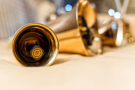 Set of gold handbells on table during concert. Christmas time