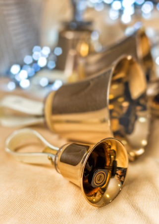 Handbells set of music on the table blurred with bokehの写真素材