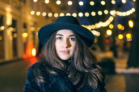 Close-up portrait of model woman with dark hatの写真素材