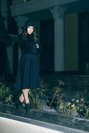 Outdoor fashion portrait of stylish young woman having funの写真素材