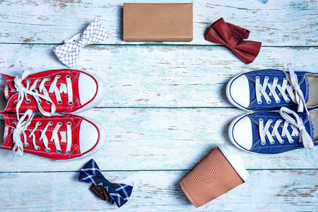 Hipster collection. Top view of clothing and diverse personal accessory for hipster laying on the wooden grainの写真素材
