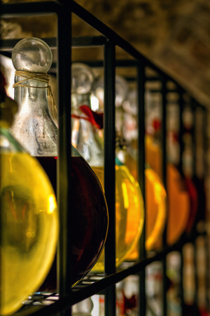 Glass bar counter with shelves alcohol bottlesの写真素材
