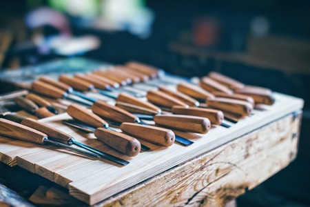 Old carpenter tools in pine wood tableの写真素材
