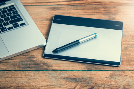 Workspace with notebook keyboard on wooden background. View from above, office table deskの写真素材